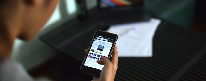 LTCI_Woman_Reading_News_on_Mobile_Wide_2.22.16.jpg
